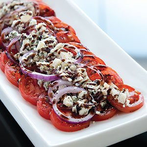sliced tomatoes with blue cheese index image